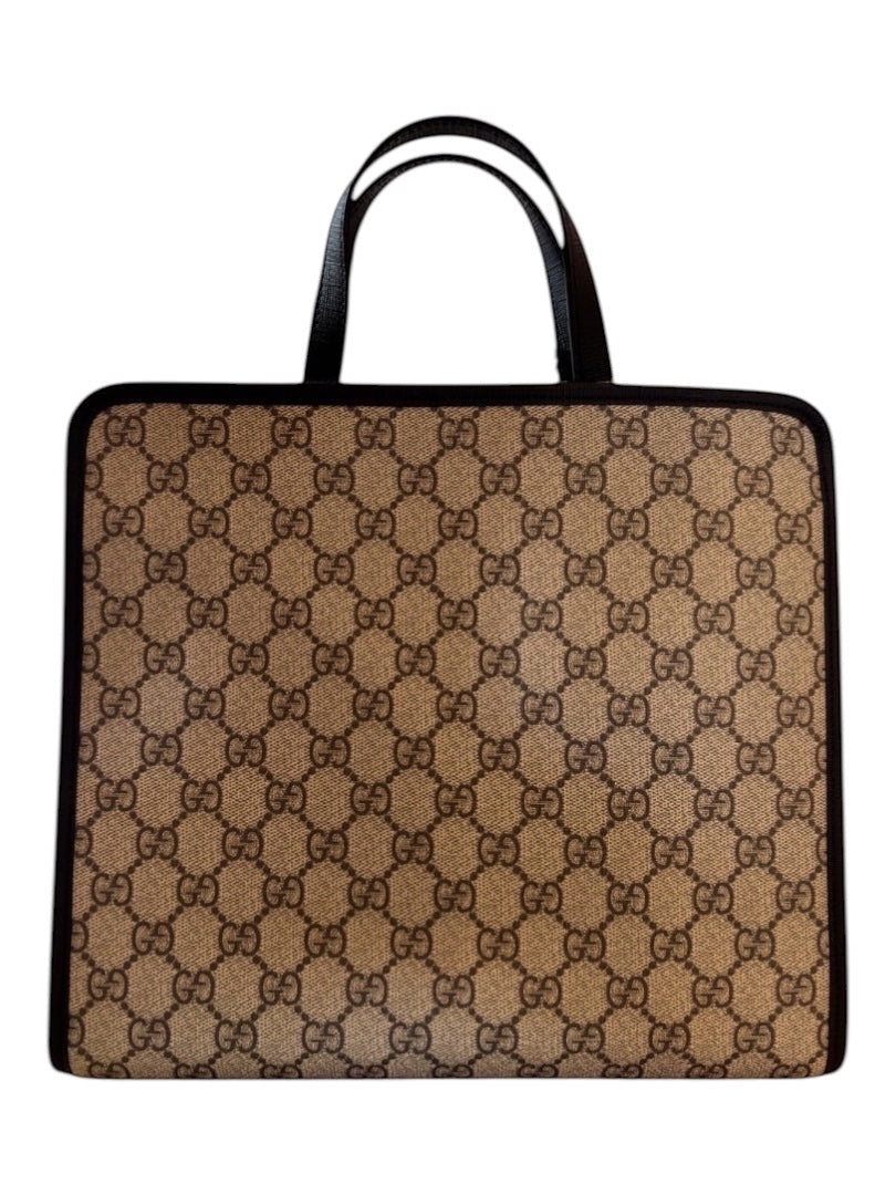 Posh Purse Co Gucci Children’s GG Supreme canvas tote bag with brown monogram print and black trim. Features double top handles and a gingham apple appliqué.