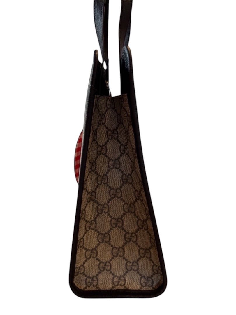 Posh Purse Co Gucci Children’s GG Supreme canvas tote bag with red and white gingham apple appliqué and leather trim.