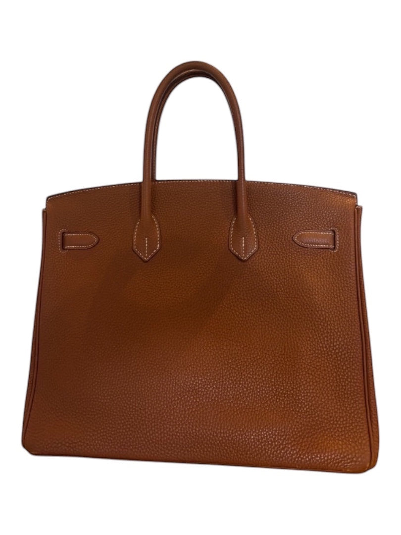 Posh Purse Co. Hermes Birkin 35 Togo leather handbag in gold with gold hardware and white stitching.