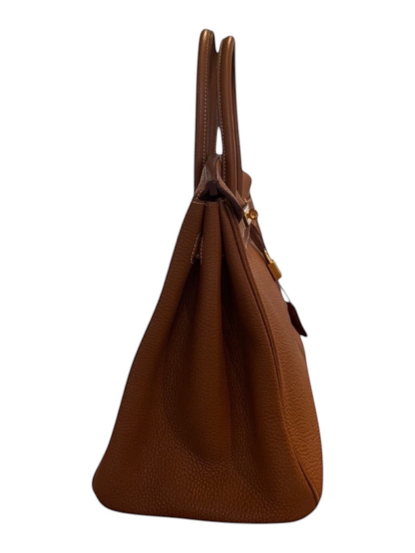 Posh Purse Co. Hermes Birkin 35 Togo leather handbag in classic gold with gold hardware. Structured, pebbled leather with dual rolled handles.