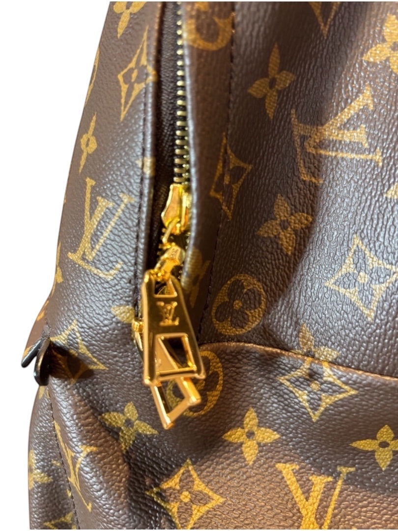 Posh Purse Co Louis Vuitton Palm Springs backpack in monogram coated canvas with gold-tone hardware and leather trim.