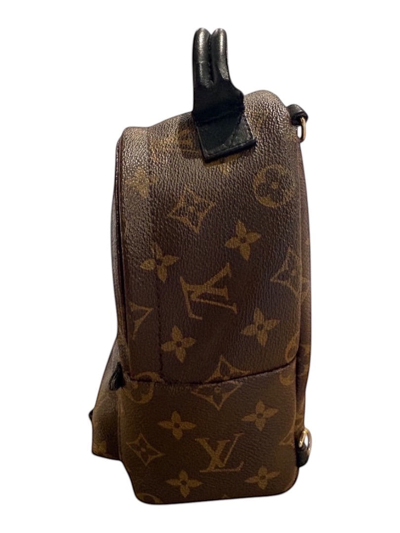 Posh Purse Co Monogram Louis Vuitton Palm Springs Mini backpack in brown LV canvas with black leather trim and top handle.