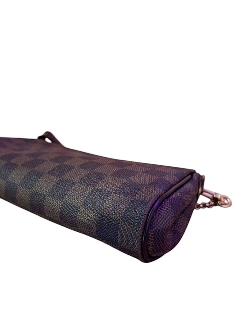 Posh Purse Co. Louis Vuitton Eva clutch in Damier Ebene coated canvas with leather trim and gold-tone hardware.