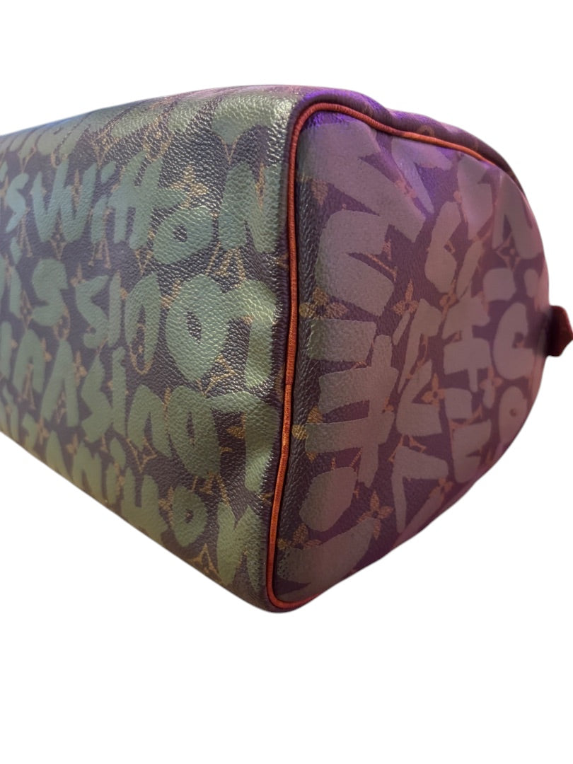 Posh Purse Co Louis Vuitton Graffiti Stephen Sprouse Speedy bag in brown coated canvas with green graffiti overlay and tan leather trim.