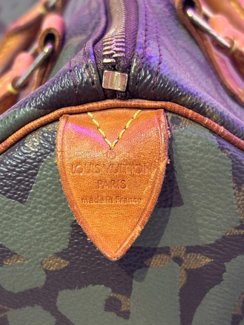 Posh Purse Co Louis Vuitton Graffiti Stephen Sprouse Speedy bag in coated canvas with leather trim and patina. Features iconic monogram with graffiti overlay.