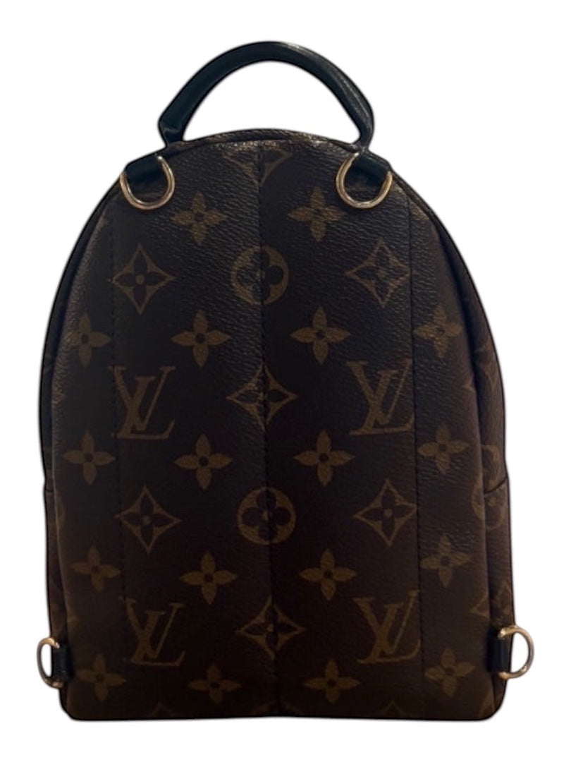 Posh Purse Co Monogram Louis Vuitton Palm Springs Mini backpack in brown LV monogram canvas with black leather trim and gold-tone hardware.