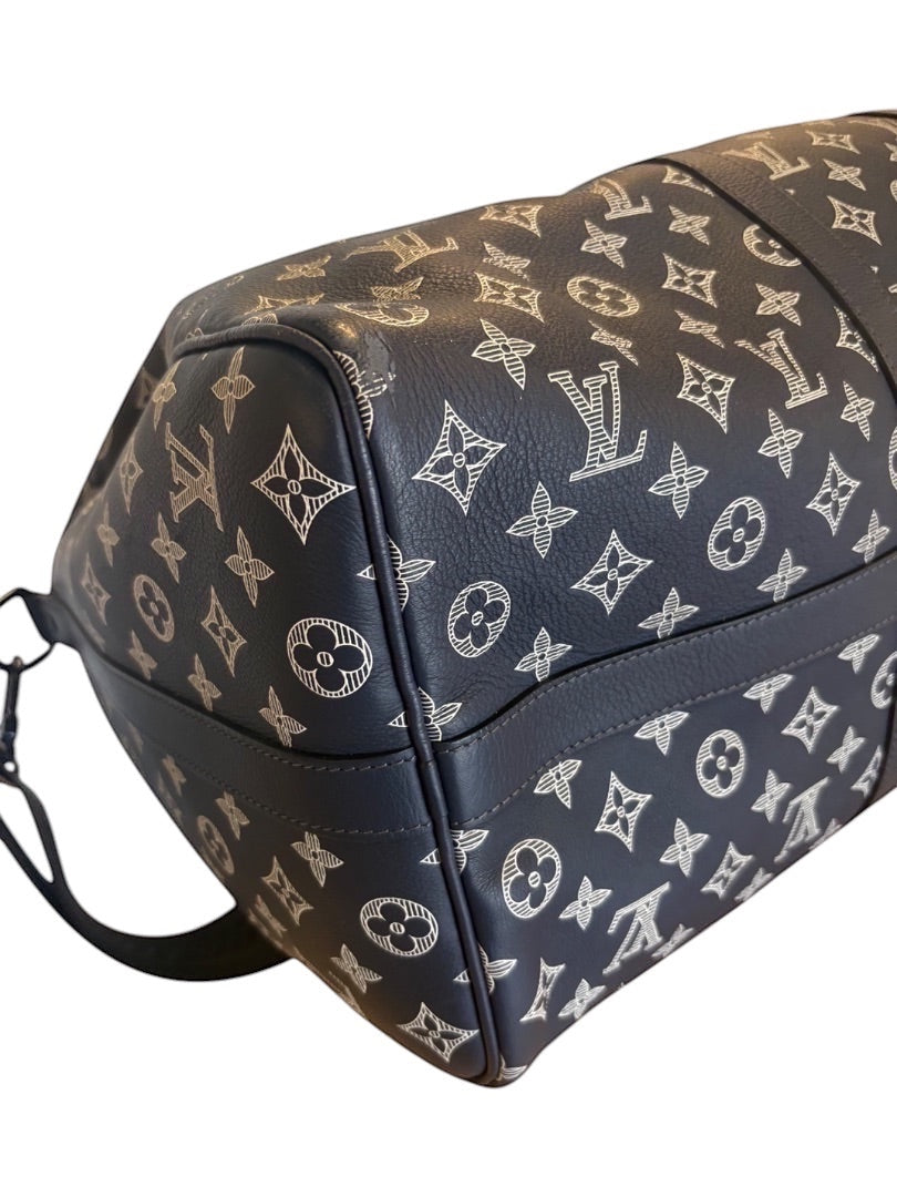 Posh Purse Co navy Louis Vuitton Monogram Shadow calfskin leather Keepall 50 travel bag with embossed pattern and leather trim.