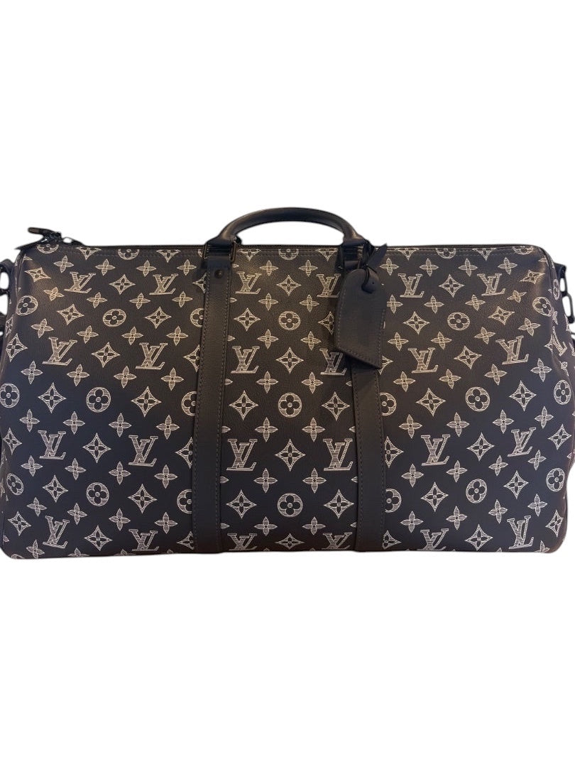Posh Purse Co navy Louis Vuitton Monogram Shadow calfskin leather Keepall 50 travel bag with embossed pattern, rolled handles, and zip closure.
