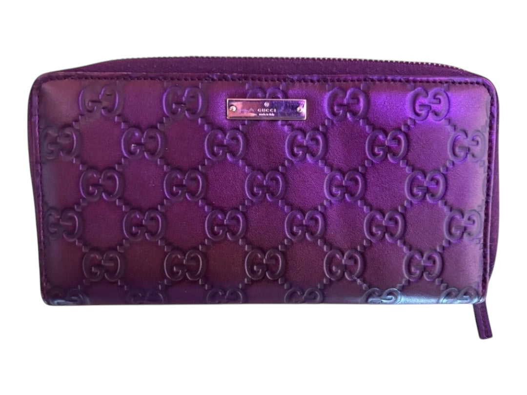 Posh Purse Co. purple Guccissima embossed leather zip-around wallet with GG monogram and silver-tone logo plate.