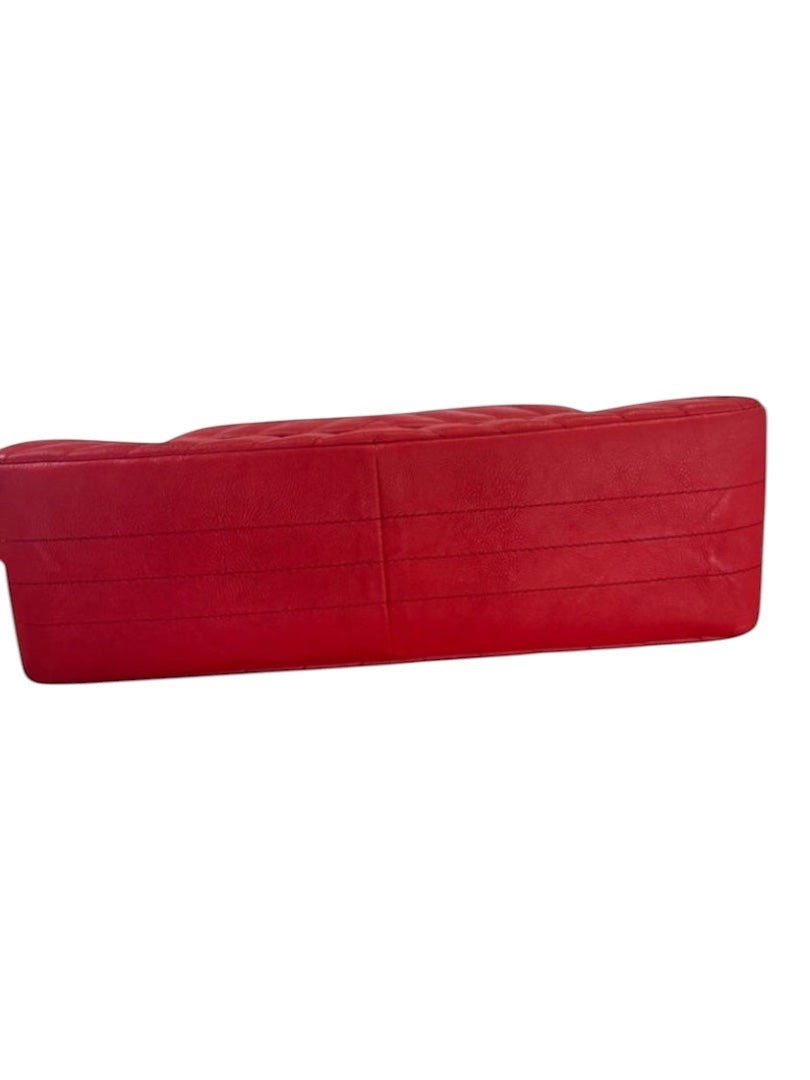 Posh Purse Co. red chevron quilted leather Chanel 2.55 Reissue double flap bag with silver hardware.