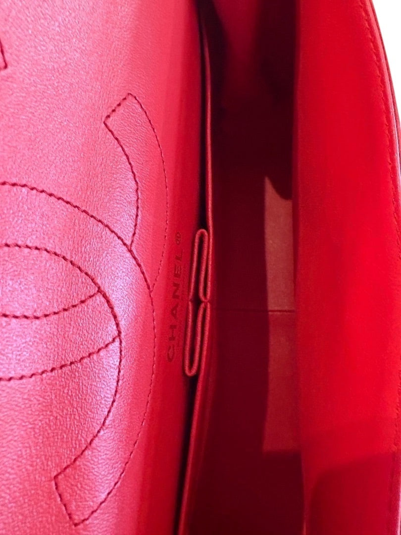 Posh Purse Co. red chevron quilted leather Chanel 2.55 Reissue double flap bag interior with embossed logo.