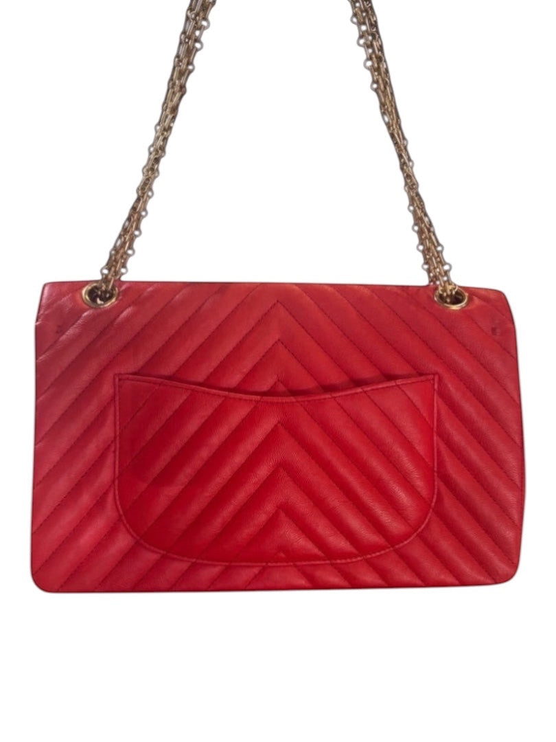Posh Purse Co. red chevron quilted leather Chanel 2.55 Reissue double flap bag with antiqued silver chain strap.