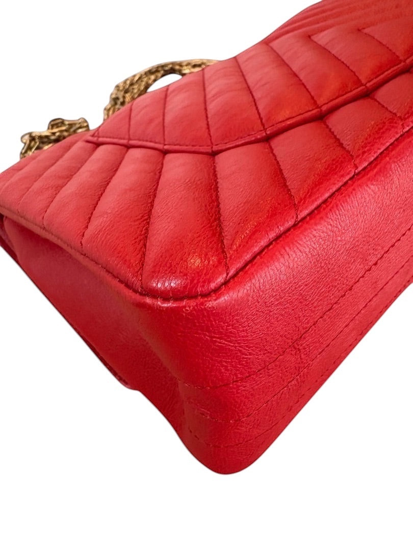 Posh Purse Co. red chevron quilted leather Chanel 2.55 Reissue double flap bag with gold chain strap.