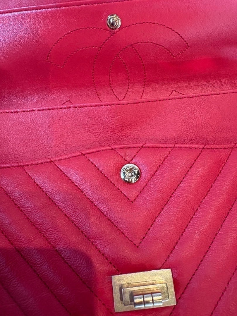 Posh Purse Co. red chevron quilted leather Chanel 2.55 Reissue double flap bag with Mademoiselle lock and antiqued silver hardware.